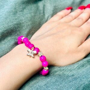 Cute pink gold color bracelet with butterfly charm.
